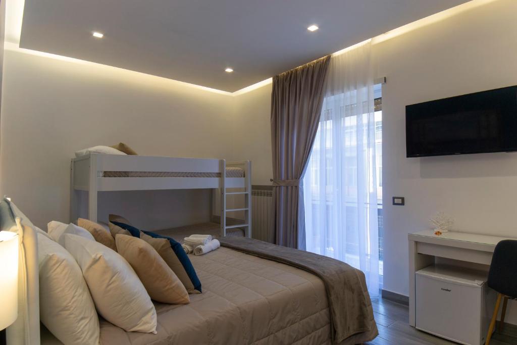 Posteľ alebo postele v izbe v ubytovaní B&B Maremy... I 4 Elementi