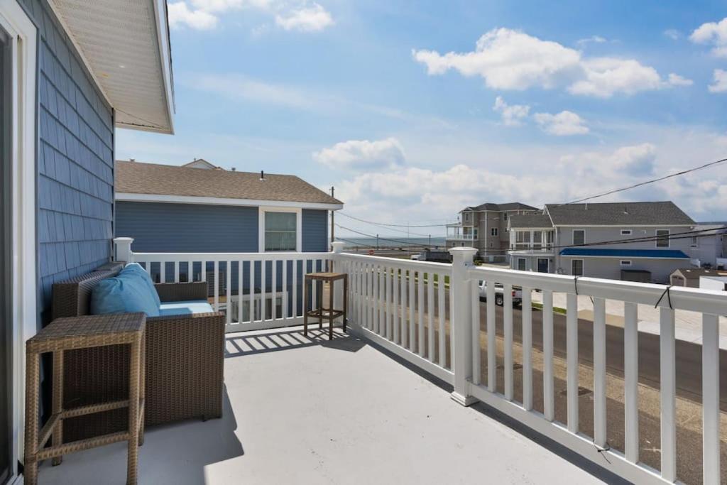 a balcony of a house with a white fence at Beach Block Parking Deck in Brigantine