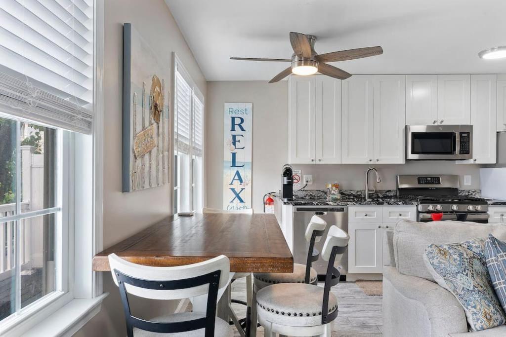 a kitchen with a table and chairs in a room at Beach Block Parking Modern Decor Porch in Brigantine