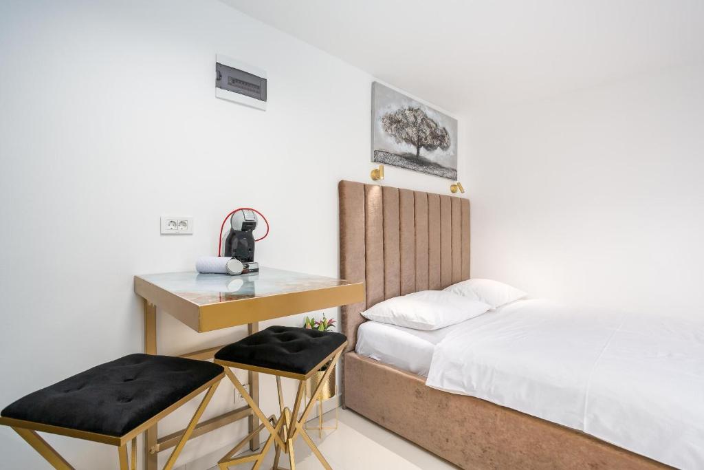 Posteľ alebo postele v izbe v ubytovaní Apartments Petra Krk