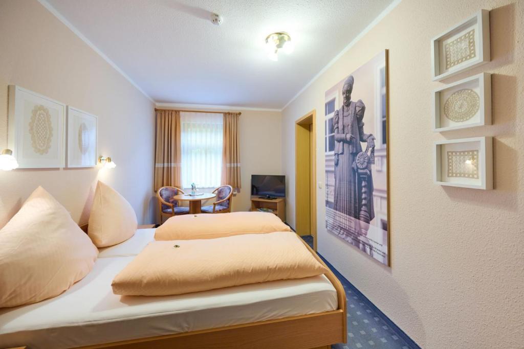 Postel nebo postele na pokoji v ubytování Hotel Vierenstraße