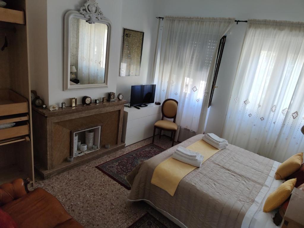 Кровать или кровати в номере La Badia del Cavaliere 2