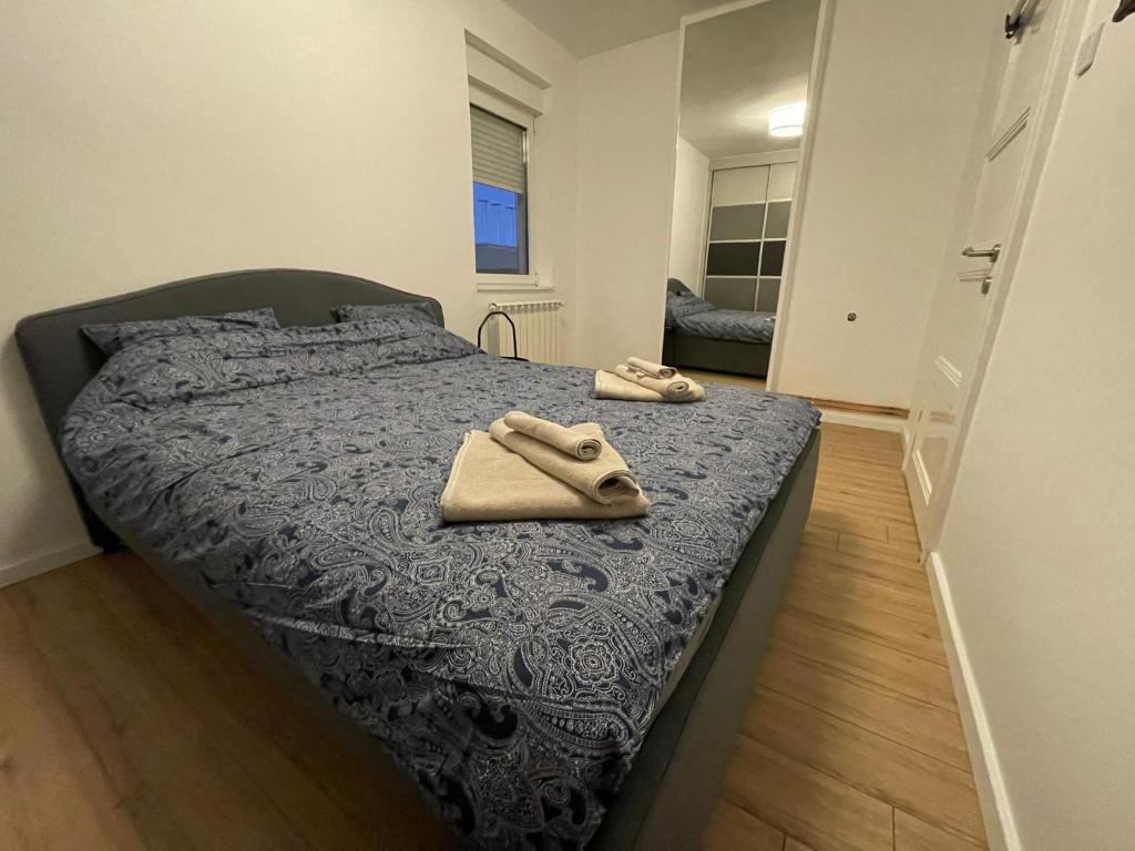 Postel nebo postele na pokoji v ubytování New Sky Terrace