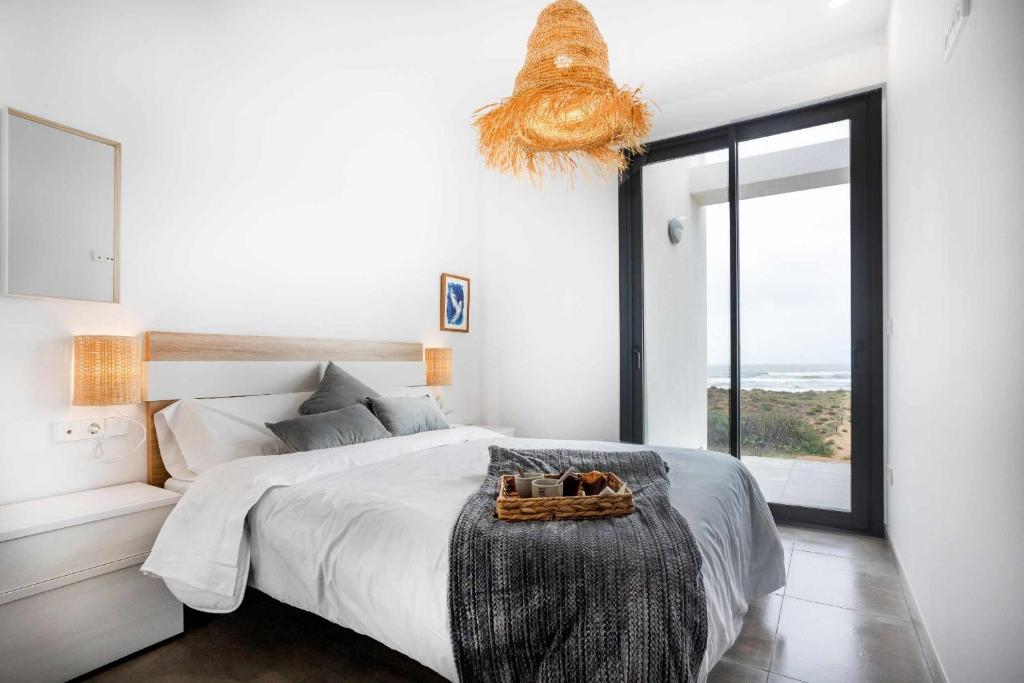 Postel nebo postele na pokoji v ubytování Oliva Suites