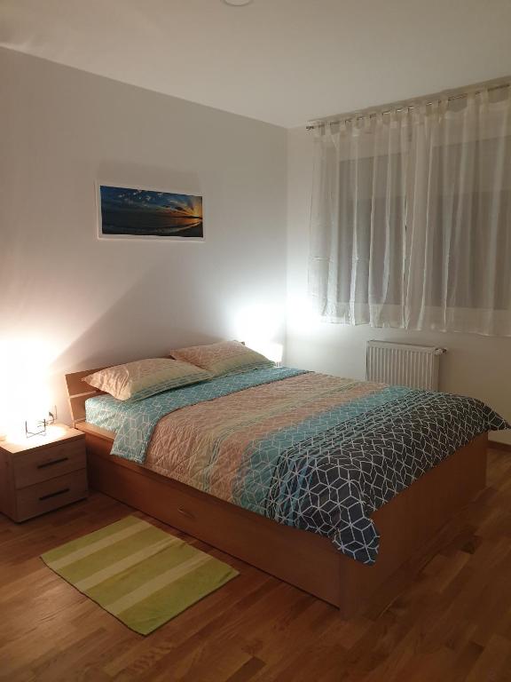 Postel nebo postele na pokoji v ubytování Apartman N&N