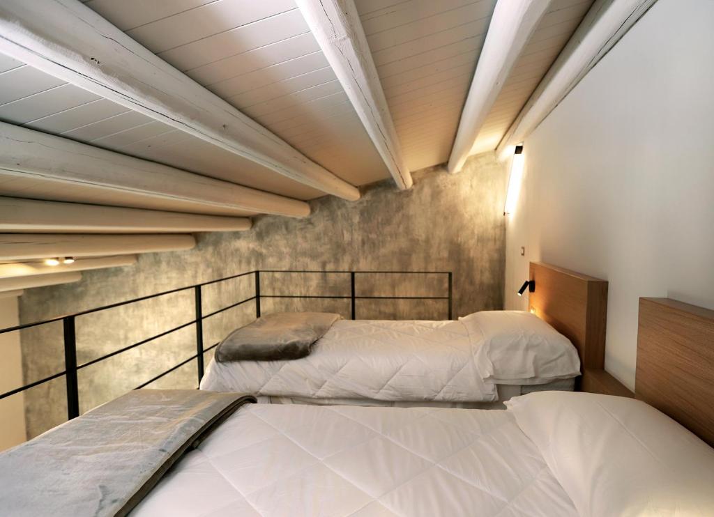 Postel nebo postele na pokoji v ubytování ACANTO -Viaggio Barocco