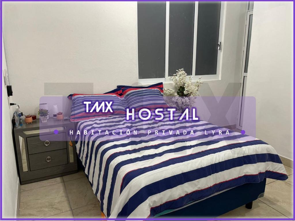 Letto o letti in una camera di TMX HOSTAL