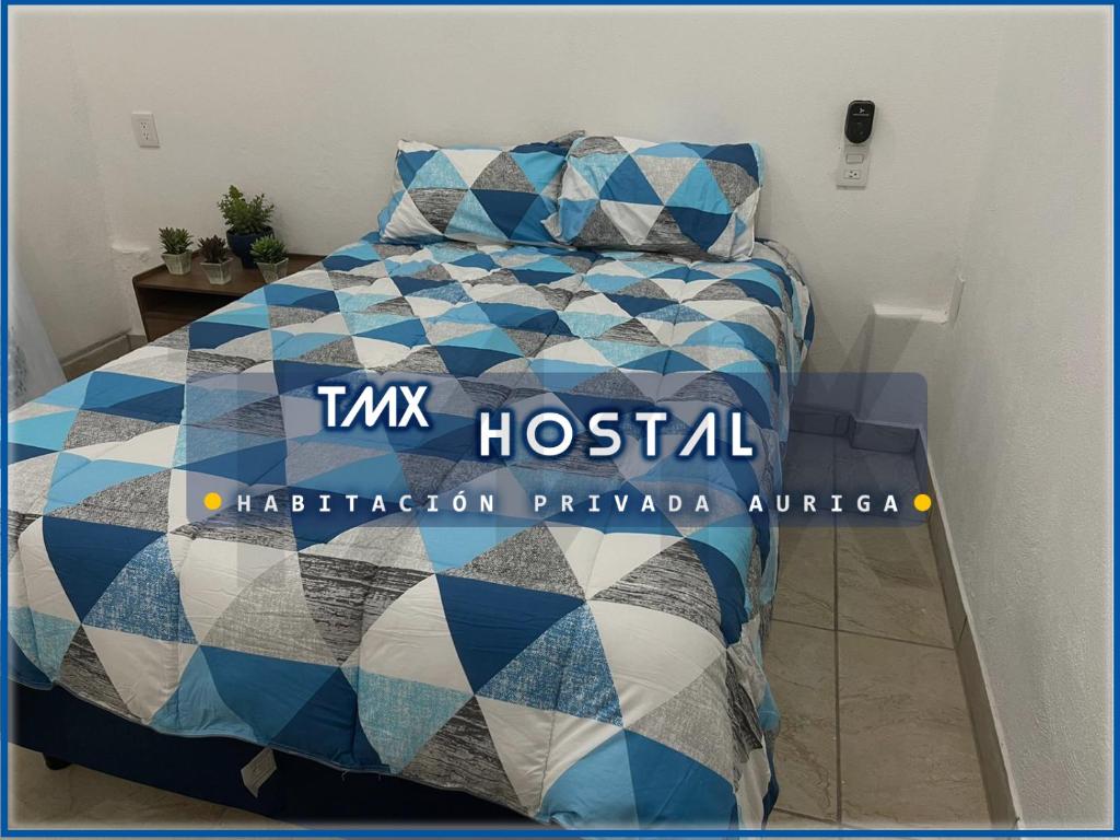 Letto o letti in una camera di TMX HOSTAL