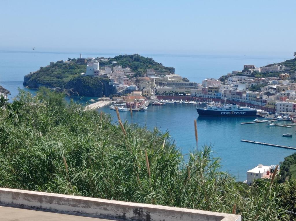 a view of a harbor with a boat in the water at The Quiet House in Ponza
