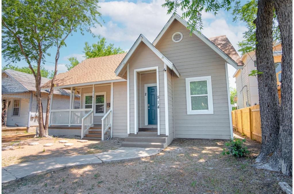 a house with a porch and a fence at Fabulous Newly Renovated 2Br1Ba Near Downtown in San Antonio