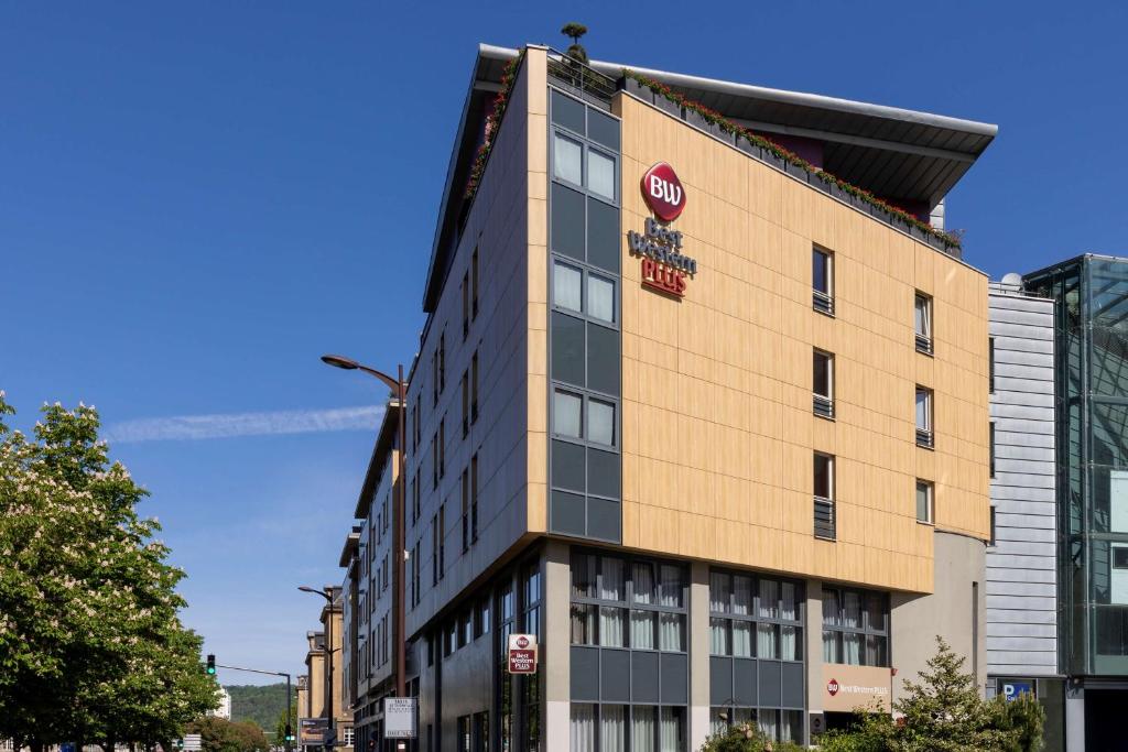 a building with a stop sign on the side of it at Best Western Plus Thionville Centre in Thionville