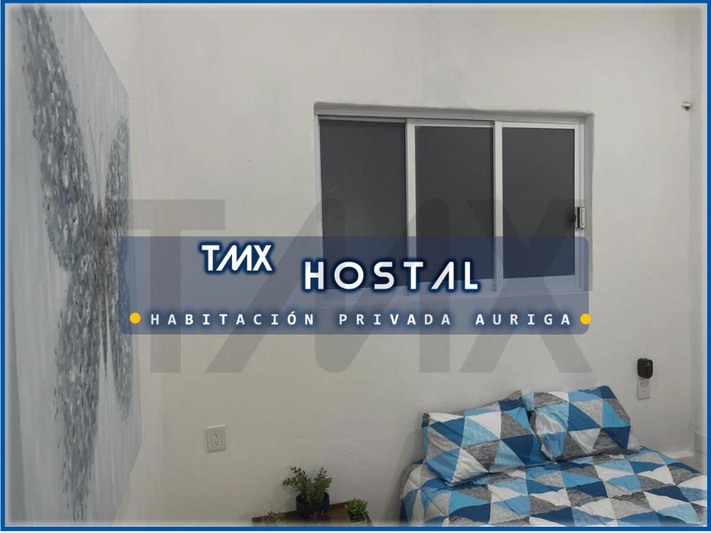 Letto o letti in una camera di TMX HOSTAL