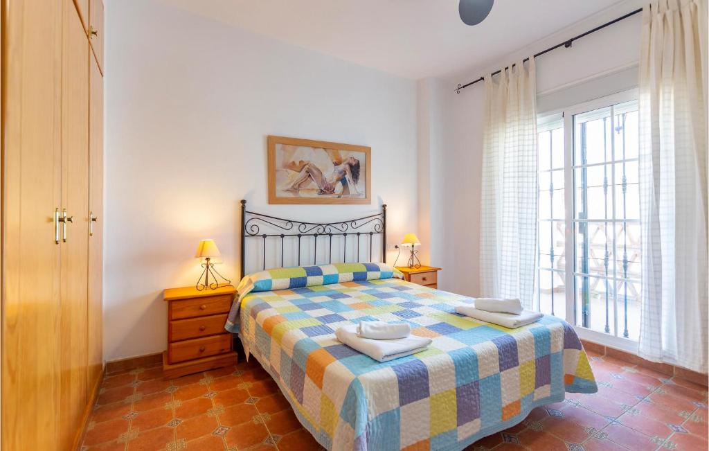 Łóżko lub łóżka w pokoju w obiekcie Cozy Apartment In Alcaucín With Wifi