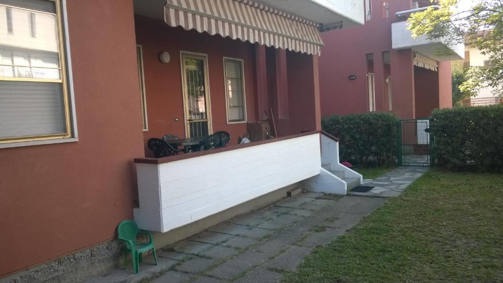 a front porch of a house with a bench at Appartamenti Fiumaretta MT 200 dalla spiaggia in Ameglia