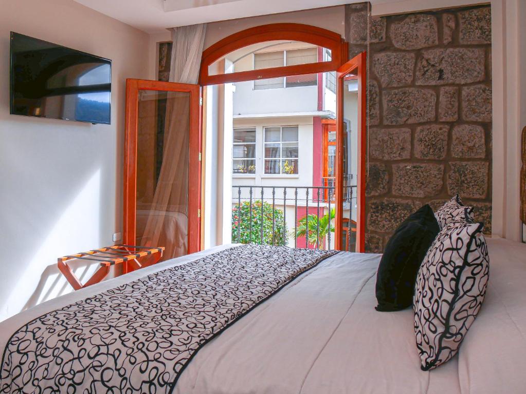 Postel nebo postele na pokoji v ubytování Sangay Spa Hotel