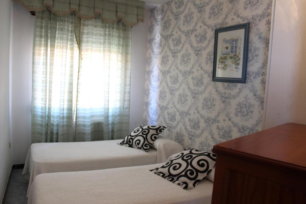 A bed or beds in a room at A Traíña