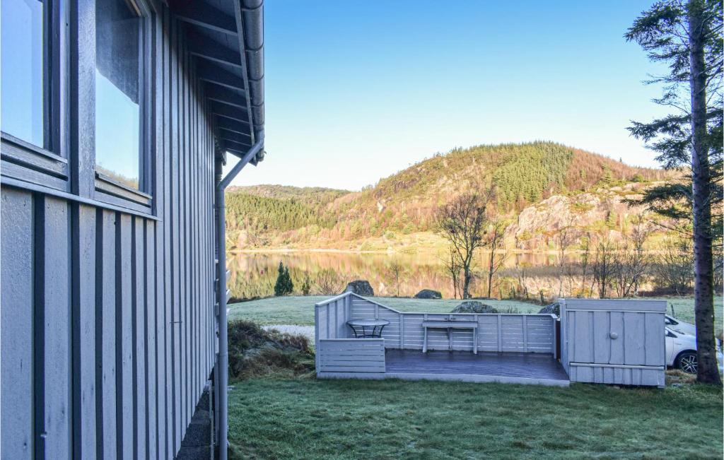 a house with a view of a lake and a mountain at 3 Bedroom Lovely Home In Helvik in Egersund