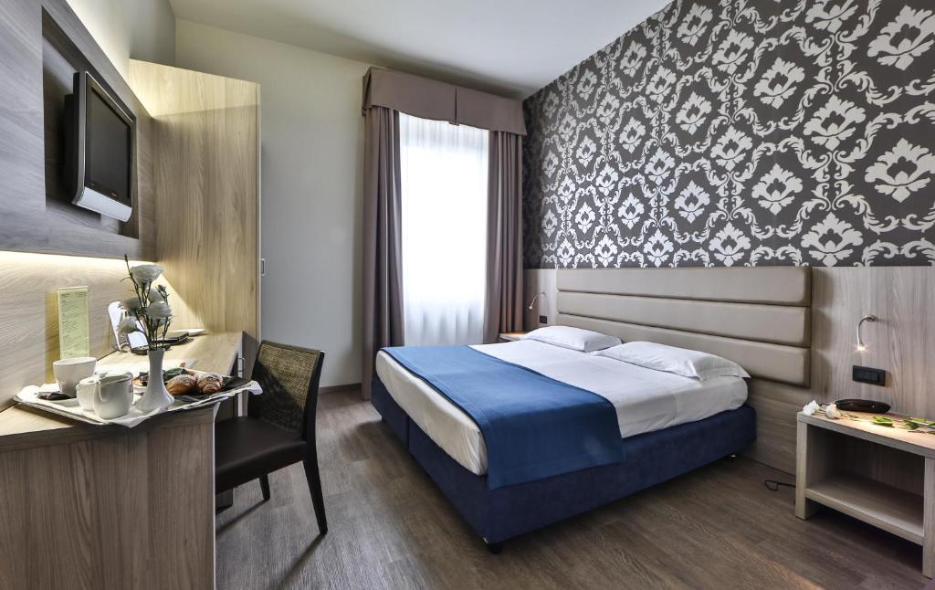 Posteľ alebo postele v izbe v ubytovaní Hotel San Marco & Formula Club