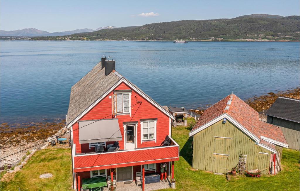 an aerial view of a house and a barn at Nice Apartment In farnes With House Sea View in Åfarnes