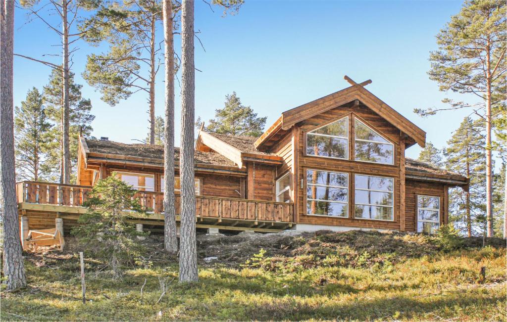 a log cabin in the woods with trees at Lovely Home In Vrådal With Sauna in Vradal