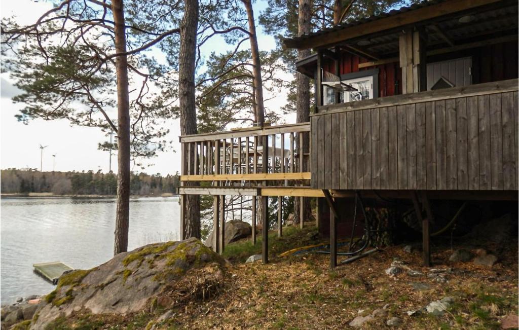 a house on the shore of a body of water at Stunning Home In Herrng With Kitchen in Herräng
