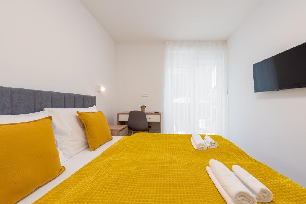 Posteľ alebo postele v izbe v ubytovaní Apartmani Diva