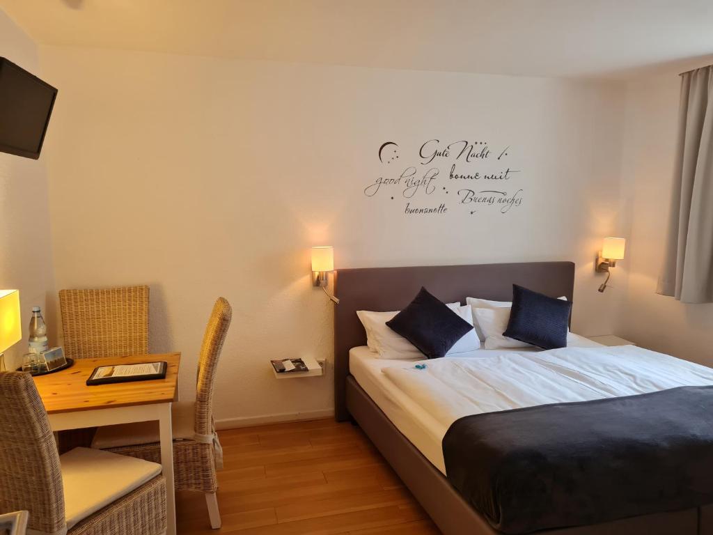 Postel nebo postele na pokoji v ubytování Hotel Herrenhof