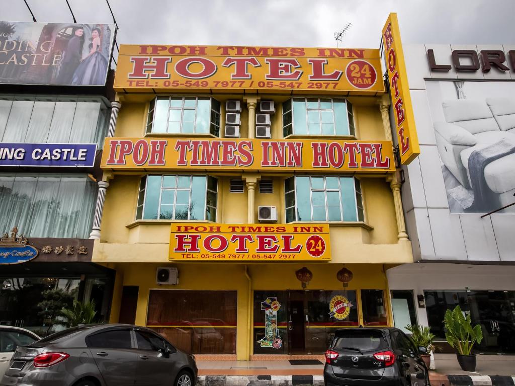a hotel with neon signs on the front of it at Ipoh Times Inn Hotel in Ipoh
