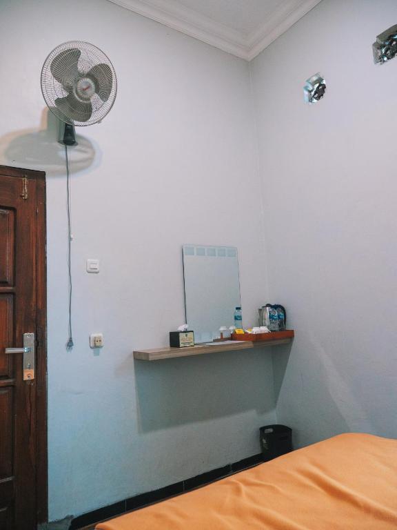Postel nebo postele na pokoji v ubytování Tumpaksewu Homestay