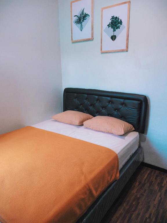Postel nebo postele na pokoji v ubytování Tumpaksewu Homestay