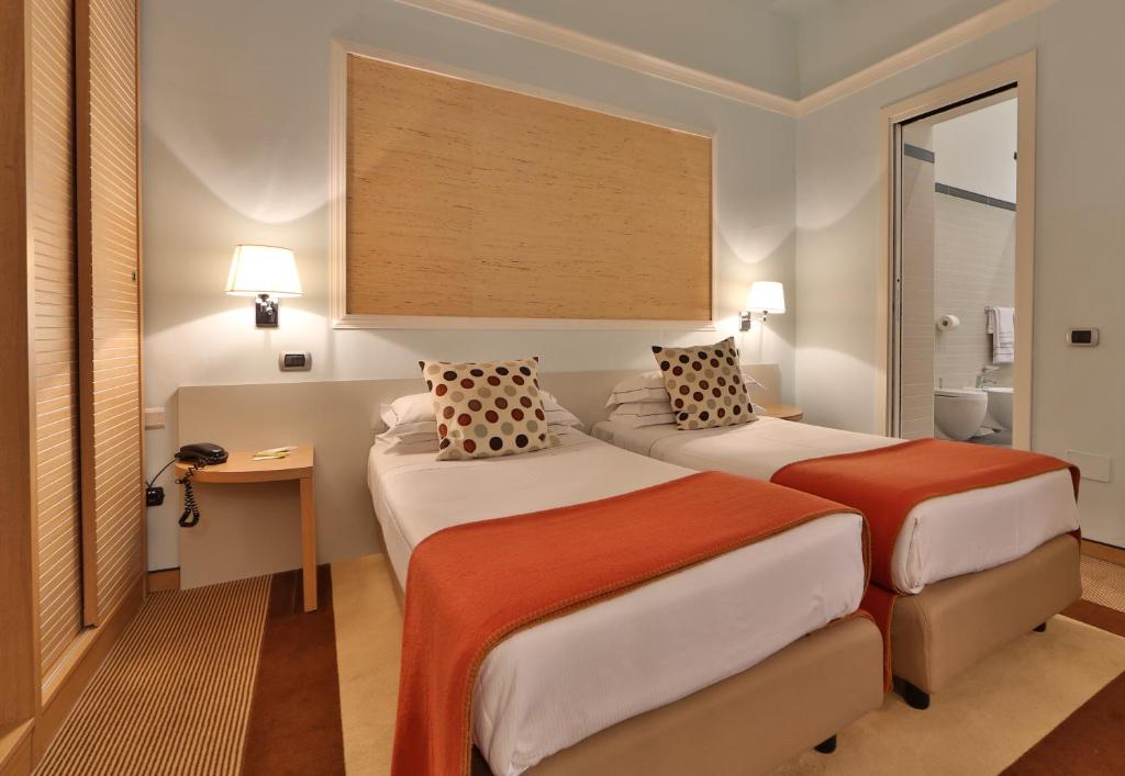 Posteľ alebo postele v izbe v ubytovaní Hotel San Marco & Formula Club