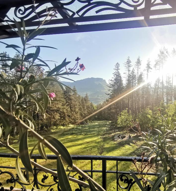 a view from the balcony of a house in the mountains at Вила АРБОРЕТУМ in Teteven