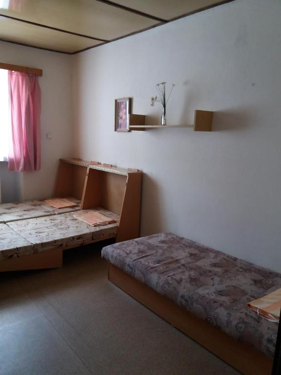Postel nebo postele na pokoji v ubytování Zotavovna Kvilda