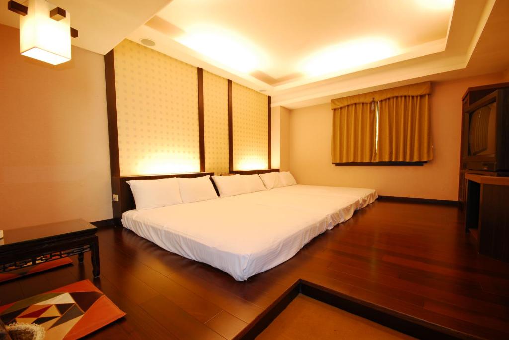 Postel nebo postele na pokoji v ubytování KaRo Hotel