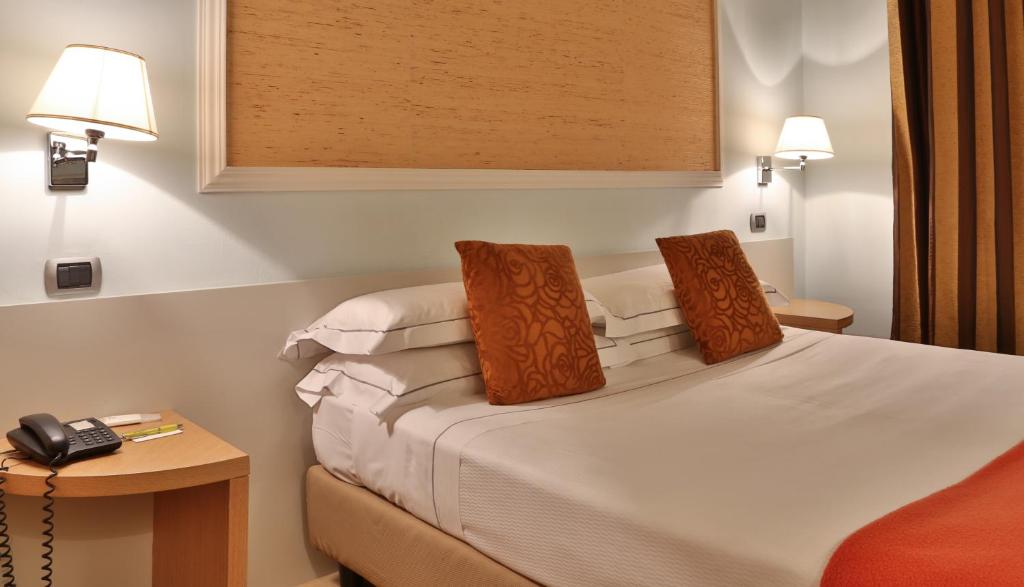 Posteľ alebo postele v izbe v ubytovaní Hotel San Marco & Formula Club