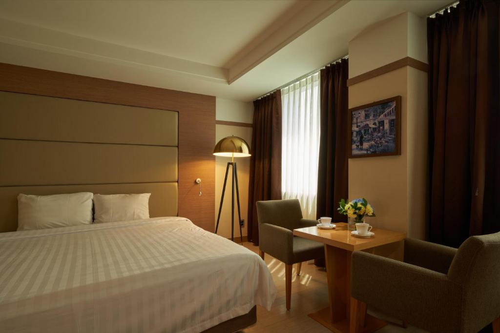 Postel nebo postele na pokoji v ubytování Gyeongju GG Tourist Hotel