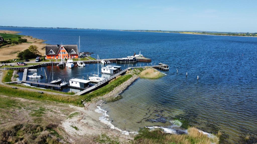 an aerial view of a dock with boats in the water at Hausboote und Fewo Vieregge in Vieregge