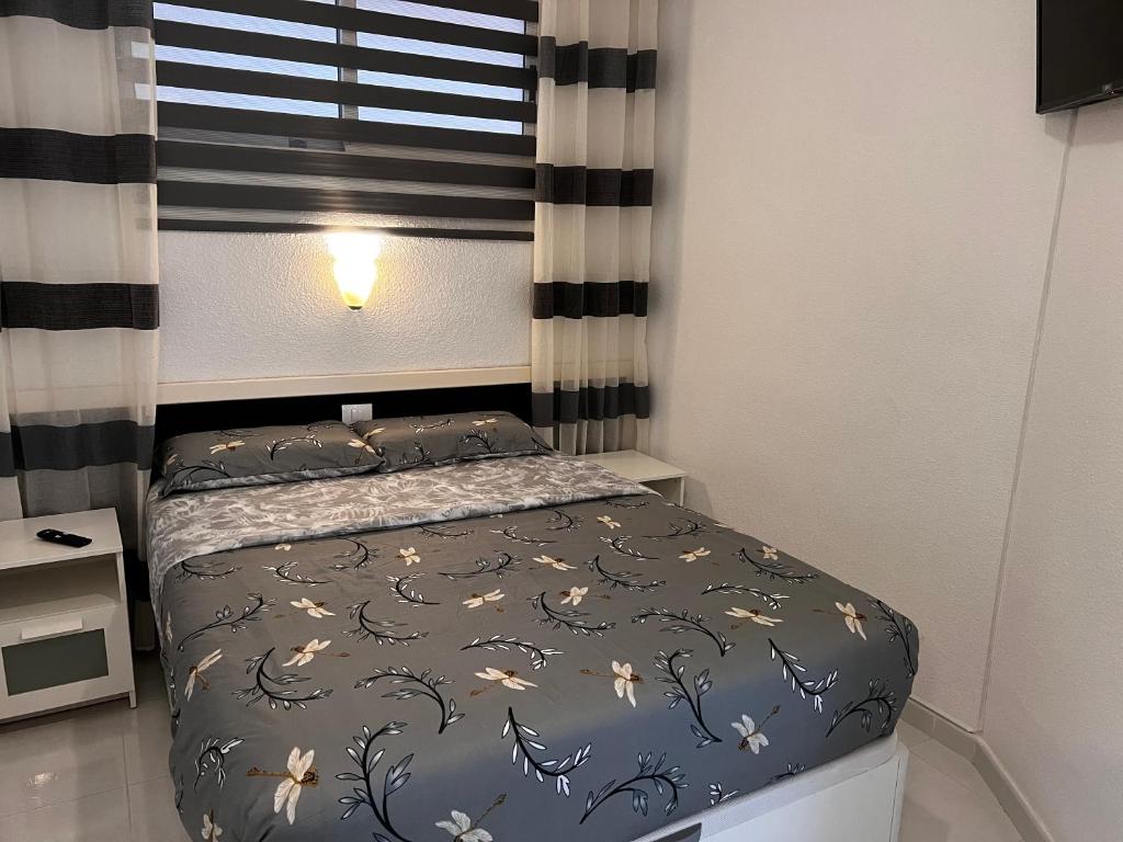 A bed or beds in a room at Seafront Playa del Cura apartment