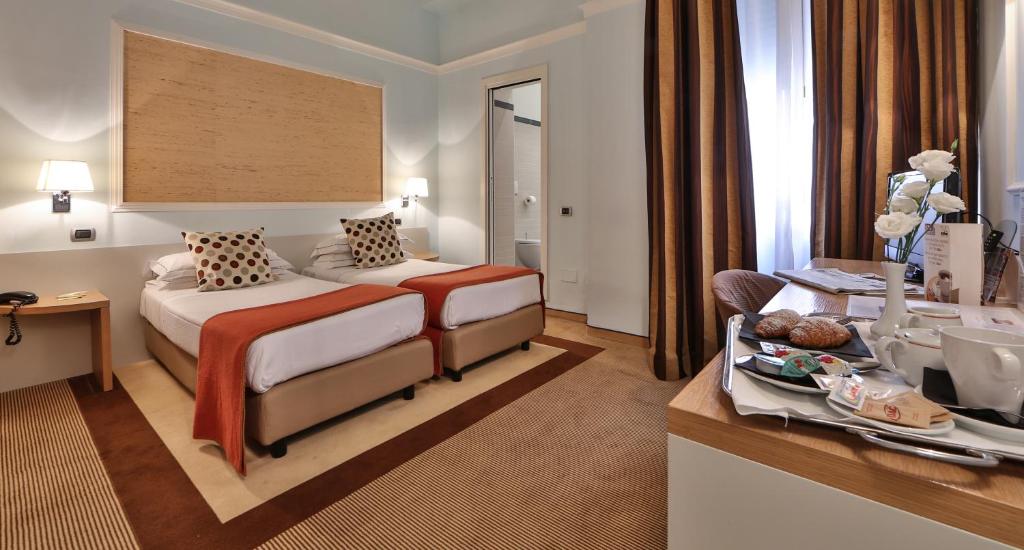 Posteľ alebo postele v izbe v ubytovaní Hotel San Marco & Formula Club