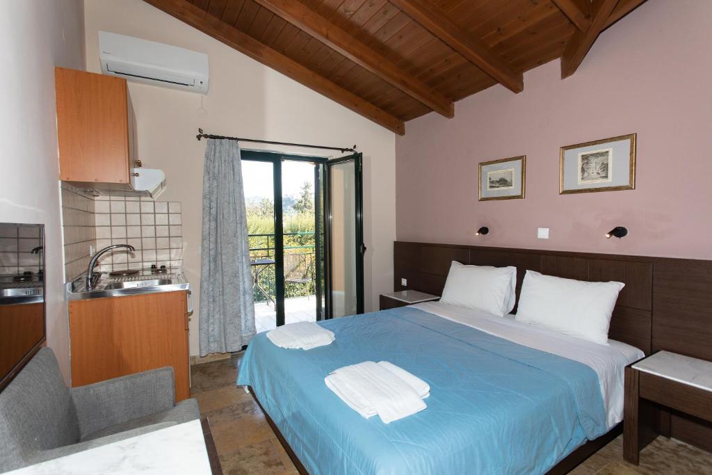 A bed or beds in a room at Villa Vasso