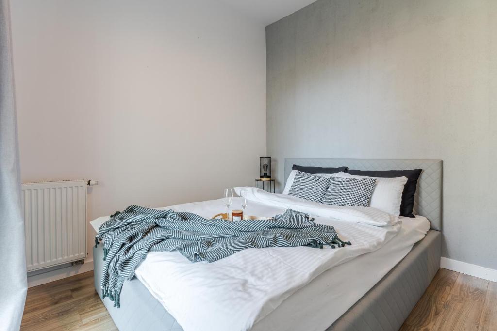 Postel nebo postele na pokoji v ubytování Loft Apartments