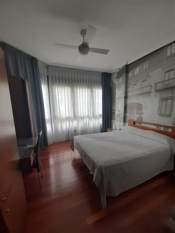 Postel nebo postele na pokoji v ubytování Hotel Photo Zabalburu