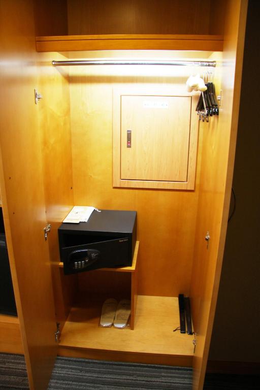 a room with a paper towel dispenser and a printer at Fushin Hotel - Tainan in Tainan