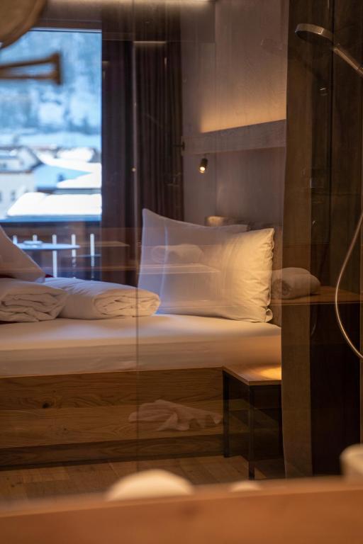 Postel nebo postele na pokoji v ubytování Hotel Post