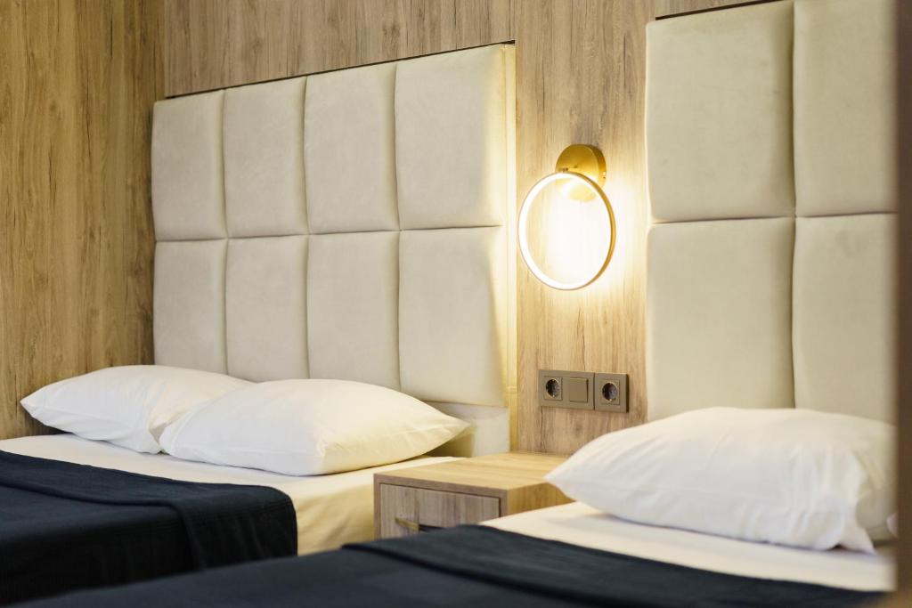 A bed or beds in a room at Hotel Centro Bodrum
