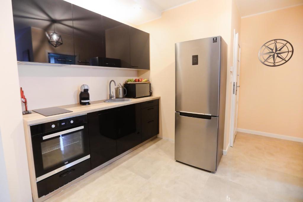 Kuchyňa alebo kuchynka v ubytovaní M&K Apartamenty Rodzinny, Gdańsk - Wyspa Sobieszewska
