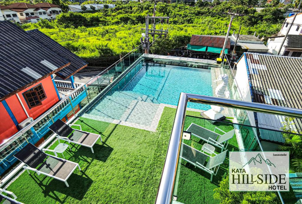 an overhead view of a swimming pool on top of a house at Kata Hillside Hotel in Kata Beach