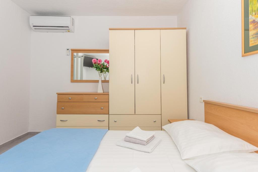 Posteľ alebo postele v izbe v ubytovaní Apartments M&A