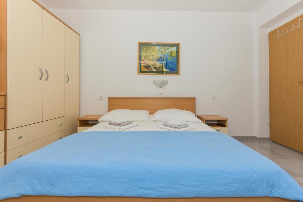 Posteľ alebo postele v izbe v ubytovaní Apartments M&A