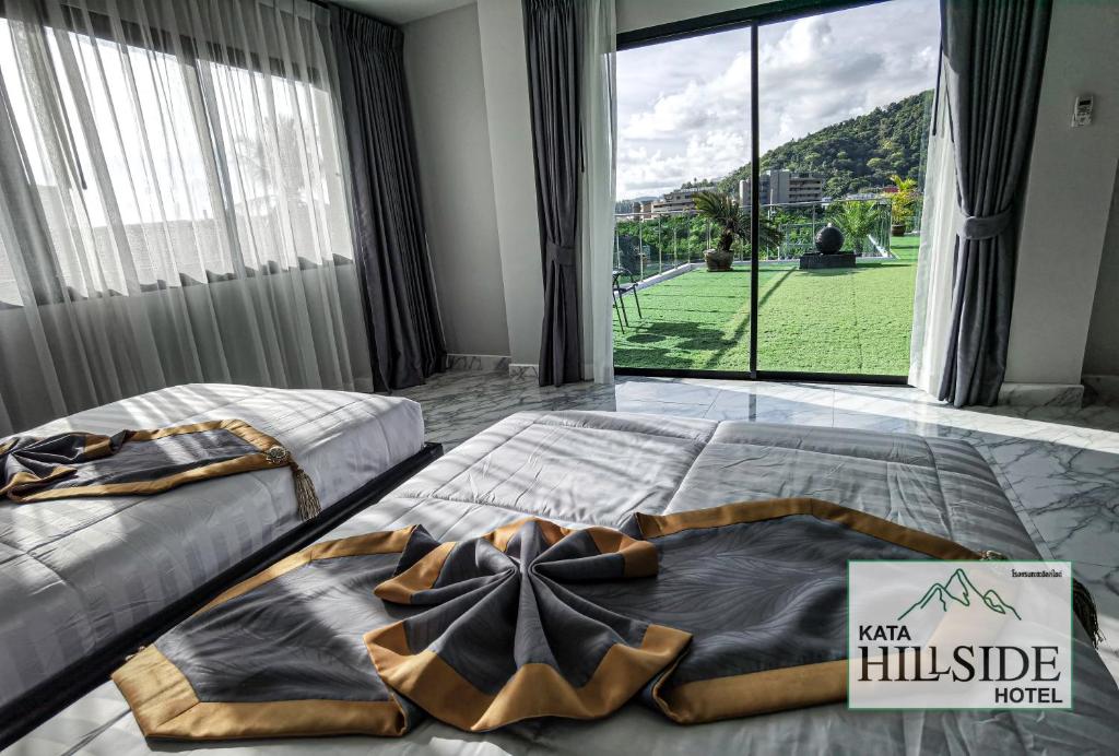 Postel nebo postele na pokoji v ubytování Kata Hillside Hotel